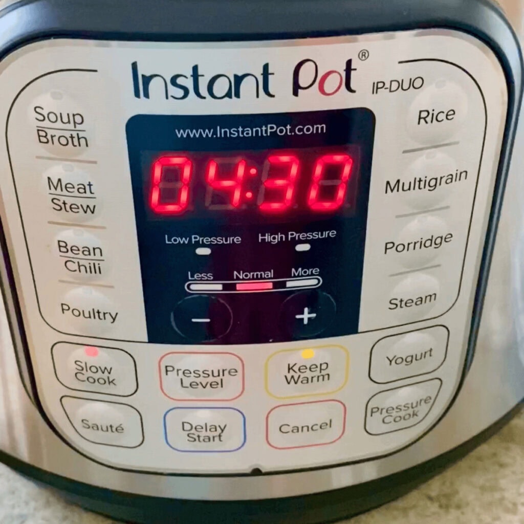An Instant Pot set to slow cooker setting for 4 hours and 30 minutes.