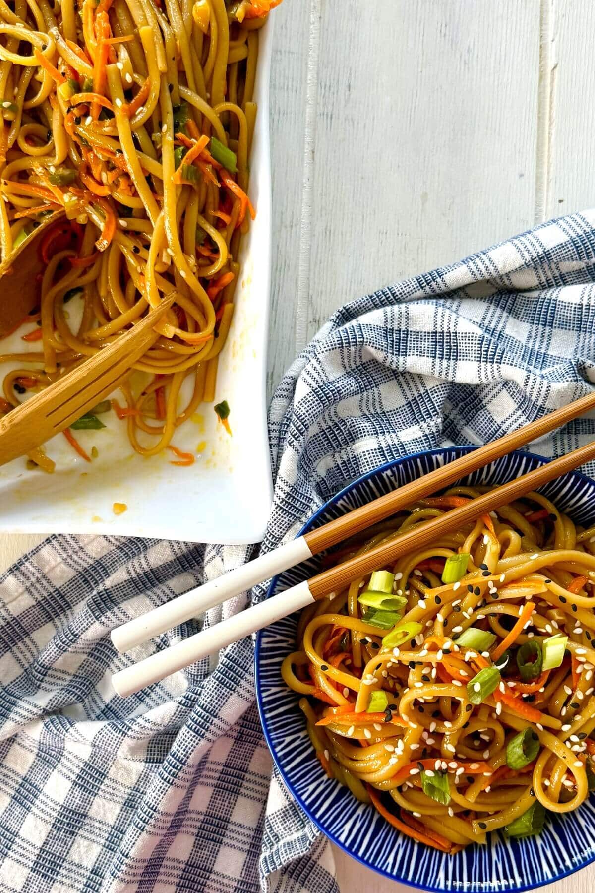 sesame noodles in a bowl with a napkin.
