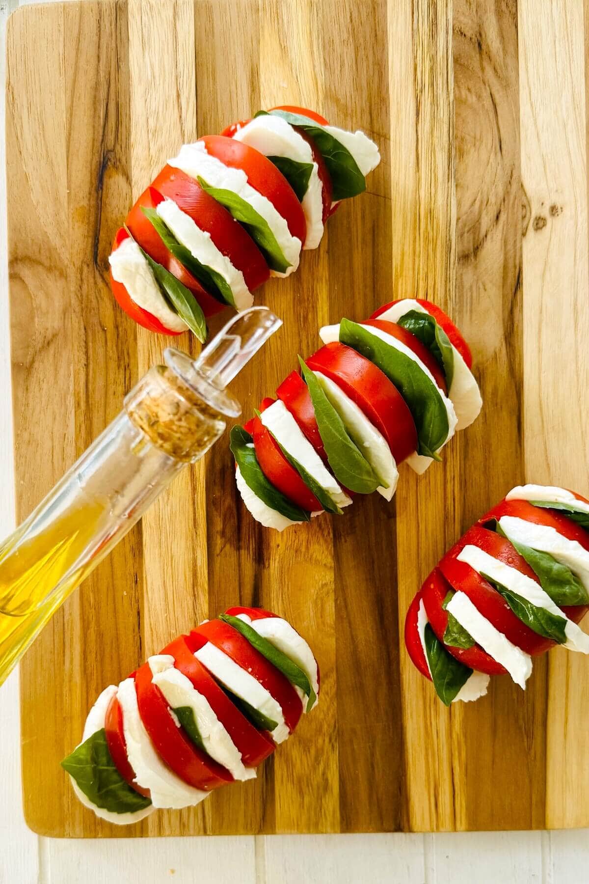 olive oil and stuffed tomatoes with mozzarella and basil.
