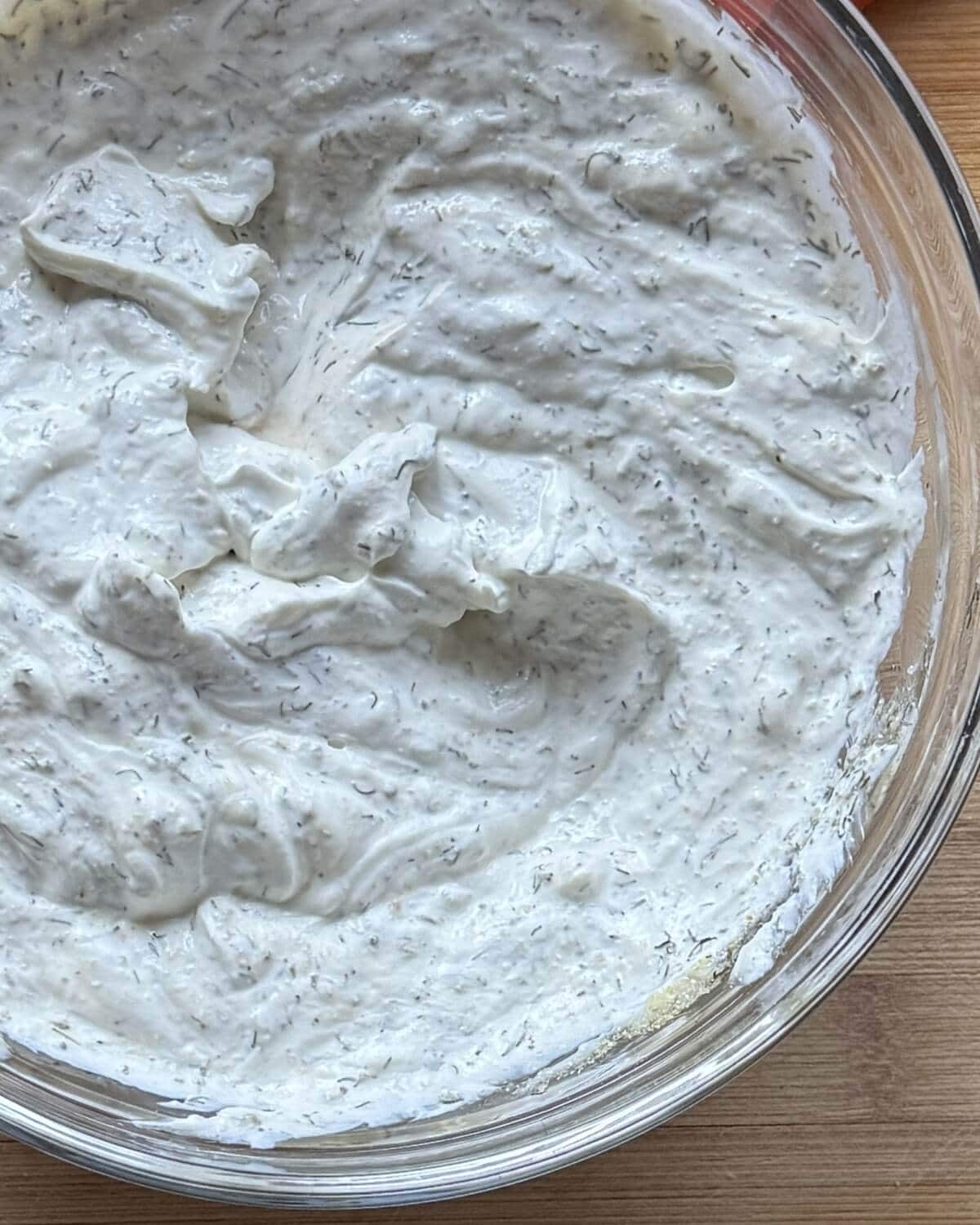 Creamy herb dip in a bowl.