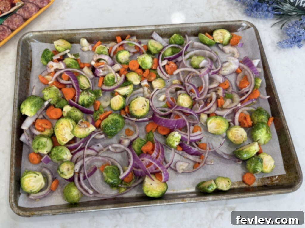Easy Sheet Pan Sweet Italian Sausage with Roasted Vegetables 4 Sheet pan Italian sausages and veggies prepared for baking
