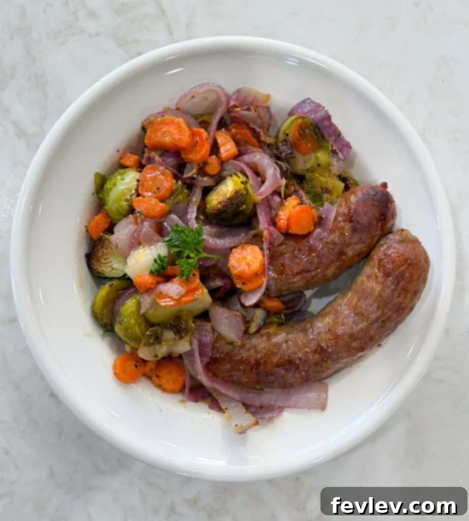 Easy Sheet Pan Sweet Italian Sausage with Roasted Vegetables 5 Plated sheet pan Italian sausages and veggies ready to eat
