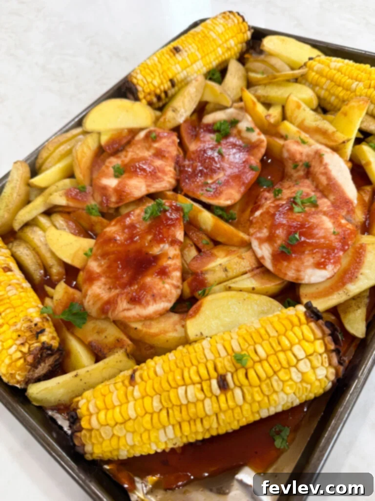 Barbecue Chicken Sheet Pan Feast 7 baked sheet pan bbq chicken - a perfectly cooked sheet pan dinner ready to be served