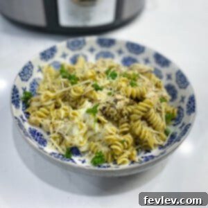 Delicious Slow Cooker Pesto Chicken Pasta ready to be served.