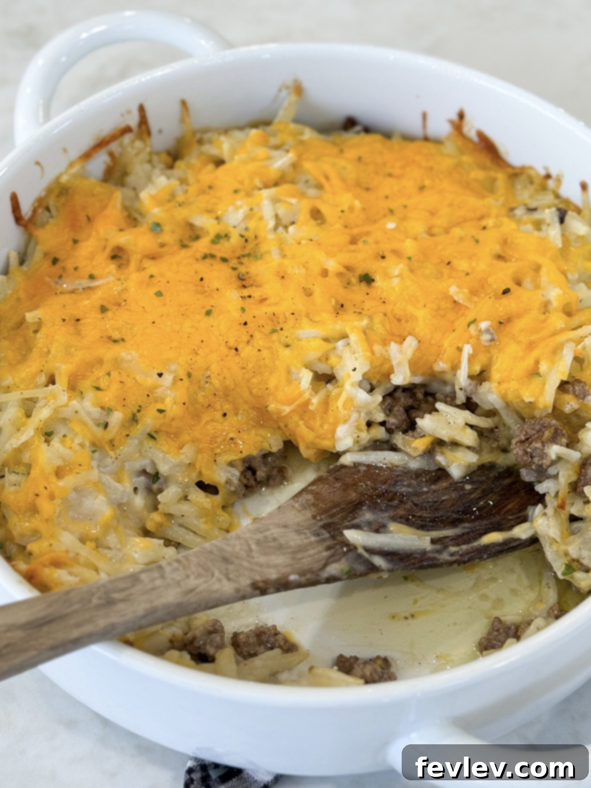 Golden Hashbrown Beef Bake 11 A golden brown, bubbly baked Hashbrown Hamburger Casserole fresh out of the oven, with perfectly melted cheese.