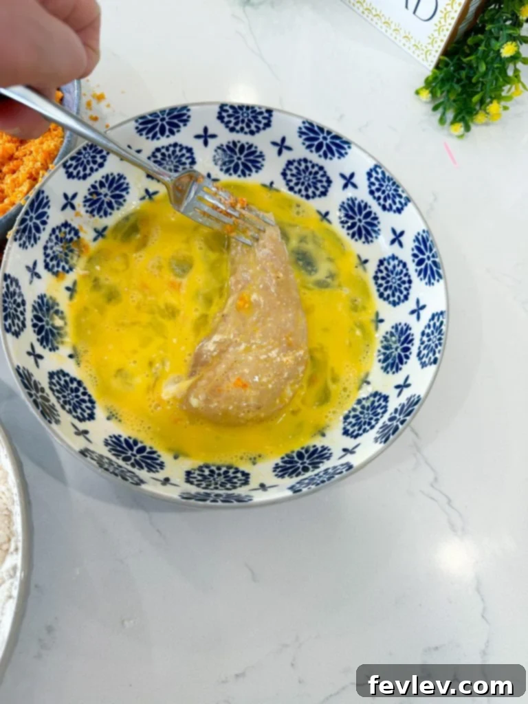 Bold Doritos Crispy Tenders 7 Whisked eggs in a bowl