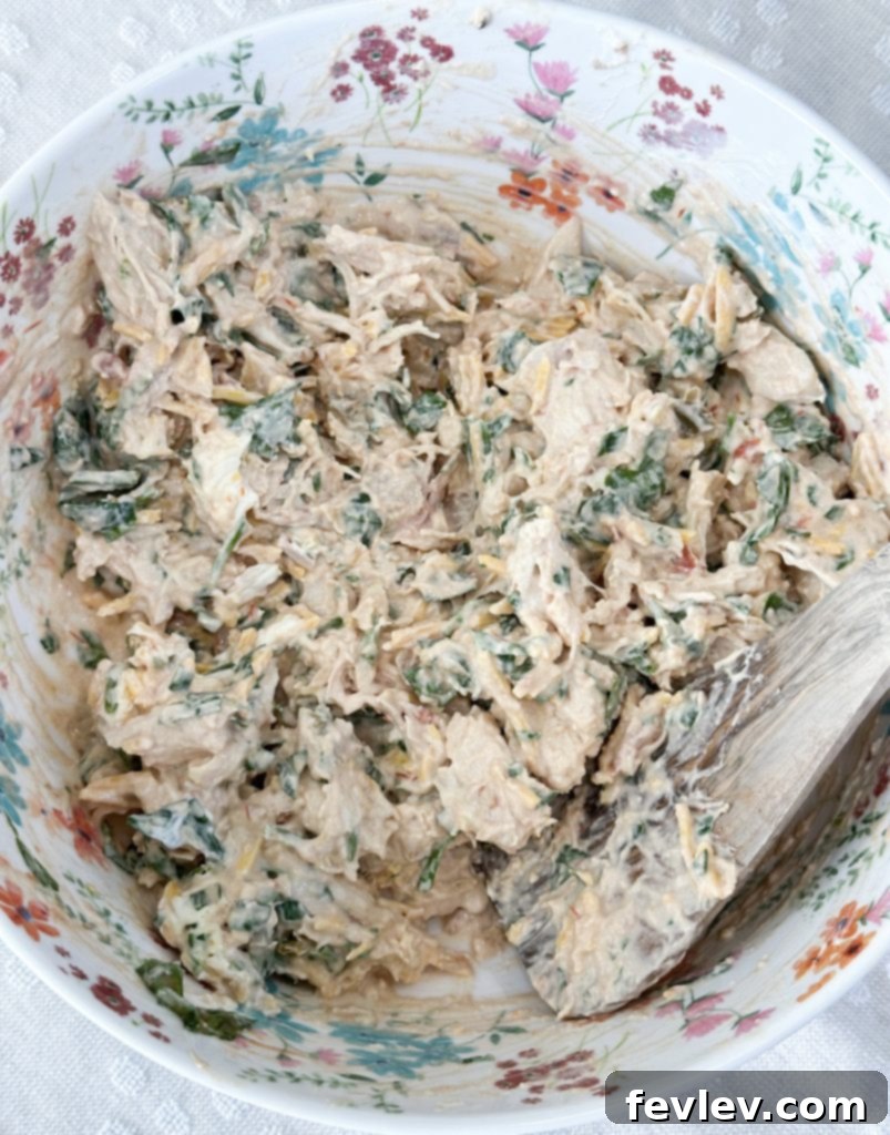 cheesy chicken taquitos filling, mixing chicken taquito ingredients