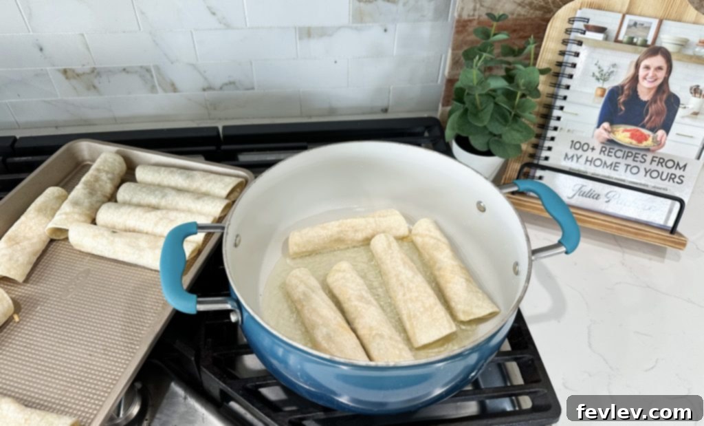 cheesy chicken taquitos frying, golden crispy taquitos