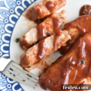 Delicious Slow Cooker Barbecue Ranch Pork Chops served with fresh parsley
