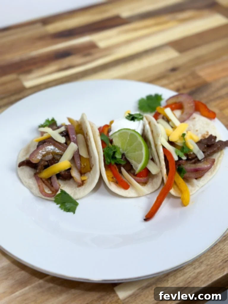 Oven-Baked Steak Fajita Feast 5 close up of cooked easy sheet pan steak fajitas