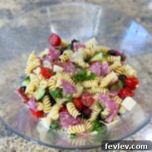Delicious Italian Pasta Salad loaded with pasta, fresh vegetables, cheese, and zesty dressing