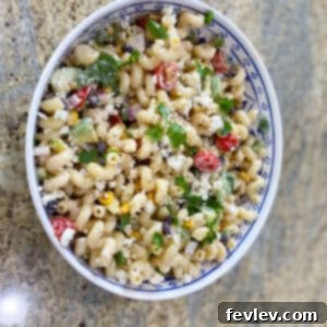 Delicious Street Corn Pasta Salad in a bowl with fresh ingredients