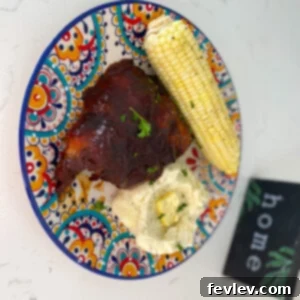 Delicious Slow Cooker Barbecue Ribs, perfectly tender and coated in rich BBQ sauce.