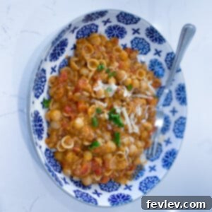 Delicious and budget-friendly American Goulash with pasta, ground turkey, and tomato sauce, topped with melted mozzarella cheese.