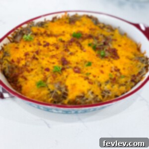Delicious Potato Turkey Bacon Casserole in a baking dish, garnished with fresh parsley.