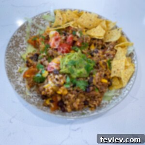 A vibrant bowl of Mexican Beef and Rice One-Pot Meal with fresh toppings
