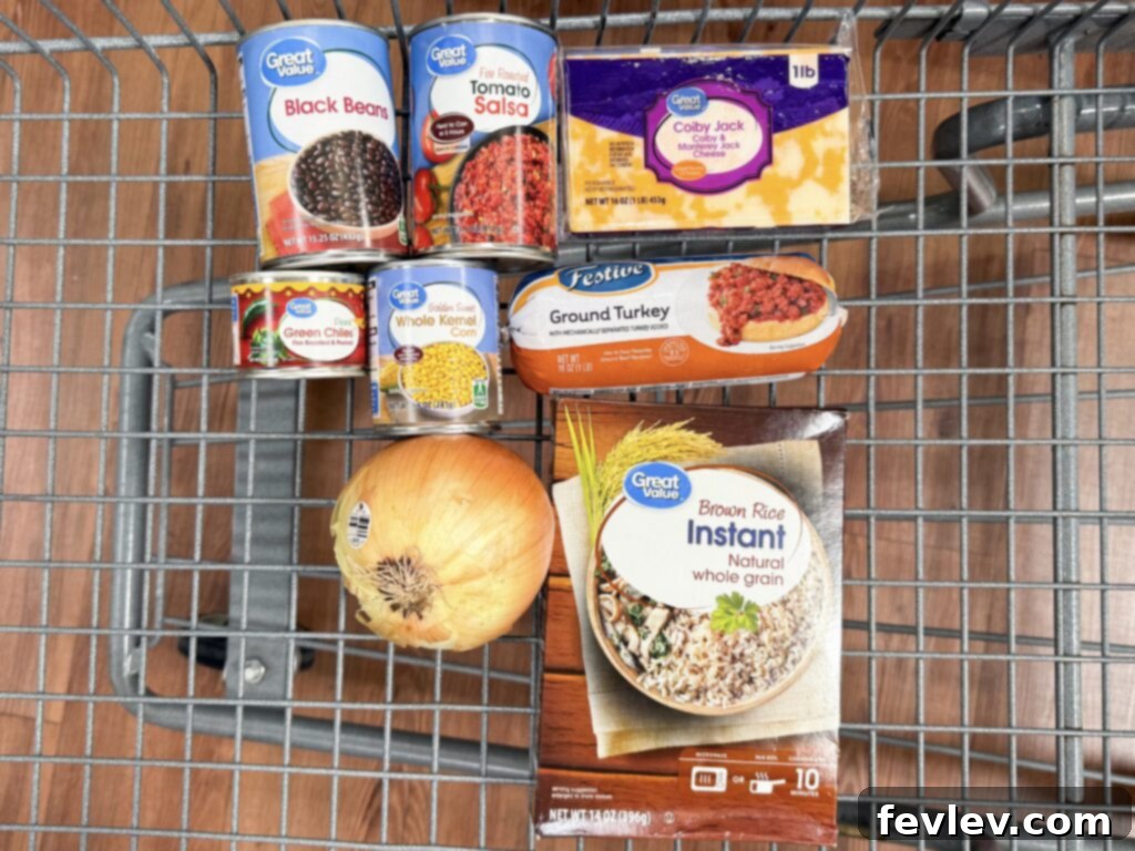 Collection of fresh ingredients for Mexican Beef and Rice One-Pot Meal including ground beef, rice, salsa, beans, and cheese