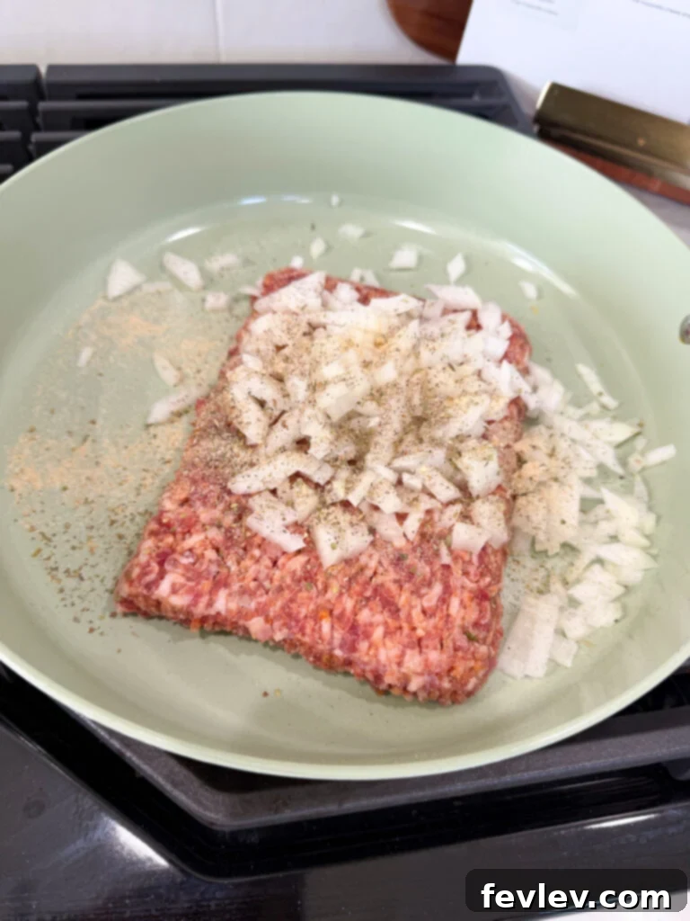 Browning Italian sausage and onions in a large pot