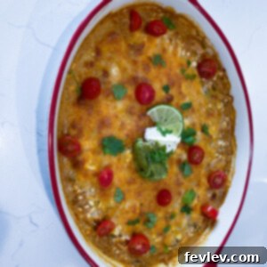 Delicious Salsa Verde Casserole with melted cheese and shredded chicken