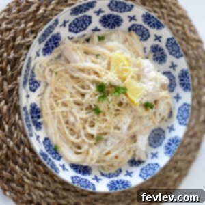 Delicious Lemon Chicken Spaghetti with shredded chicken and a creamy sauce