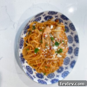 Effortless One-Pan Feta Chicken Tomato Pasta 2 A vibrant and delicious One-Pot Tomato Chicken Feta Pasta, featuring tender chicken, a rich tomato sauce, crumbled feta, and fresh basil, ready to be served.