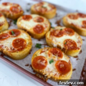 Crispy, cheesy garlic bread pizzas topped with pepperoni, ready to eat