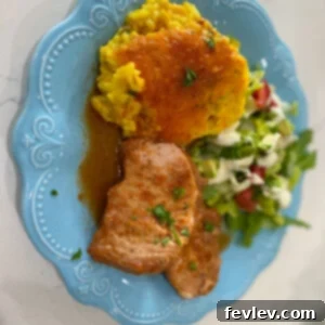 Delicious and tender Slow Cooker Coca-Cola Pork Chops, served with a rich, glossy sauce