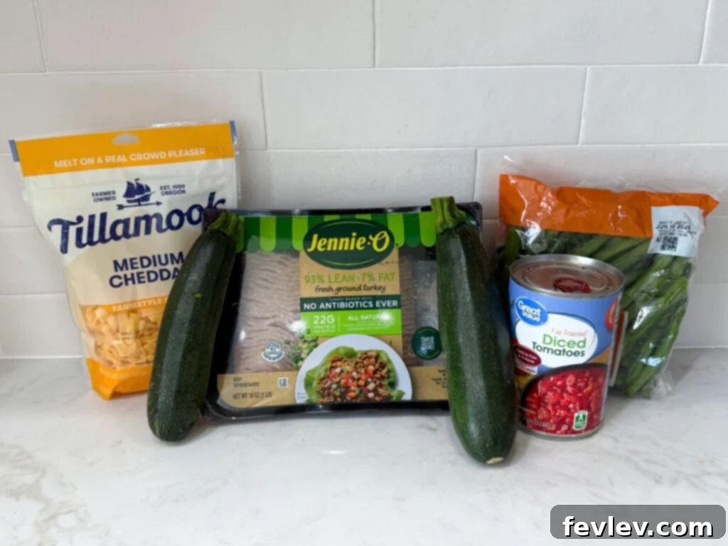 Wholesome Low-Carb Turkey and Veggie Skillet 3 Fresh ingredients for zucchini turkey skillet including zucchini, onion, green beans, ground turkey, and spices