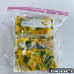 Delicious Sheet Pan Breakfast Omelette ready to be served, garnished with fresh herbs.