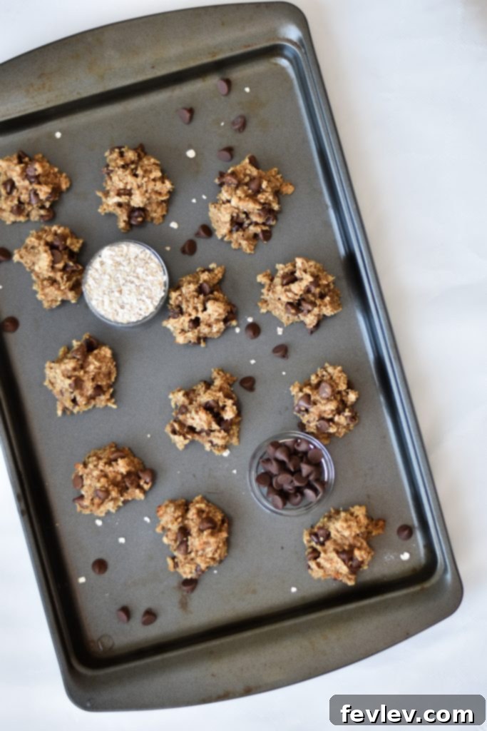 Delicious and healthy Breakfast Power Cookies, freshly baked and ready to eat, arranged on a baking sheet with parchment paper.
