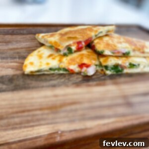 Crispy, golden Mediterranean Quesadillas bursting with fresh vegetables and melted cheese.