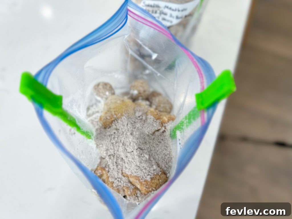 Creamy Slow Cooker Swedish Meatballs with a sprinkle of parsley
