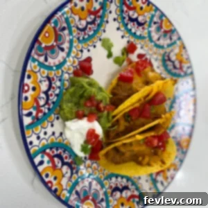 Delicious Baked Turkey Tacos with melted cheese and fresh toppings, a perfect five-dollar dinner solution.