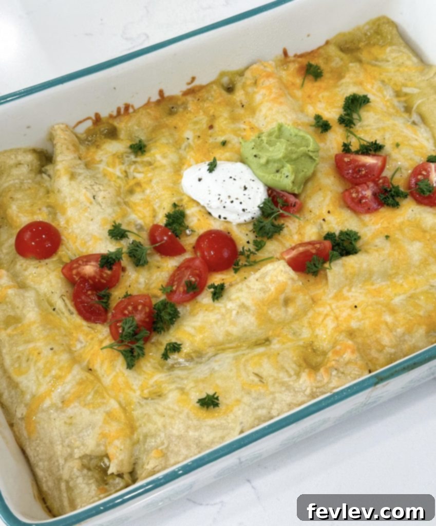 Finished Green Chile Chicken Enchiladas topped with fresh garnishes