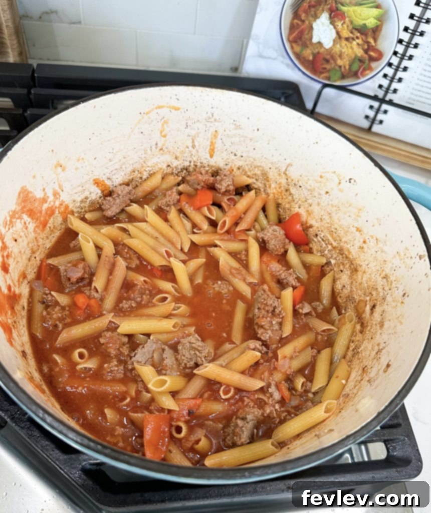 Simple Turkey Pasta Skillet 3 Sautéing lean ground turkey with vibrant vegetables for the pasta dish
