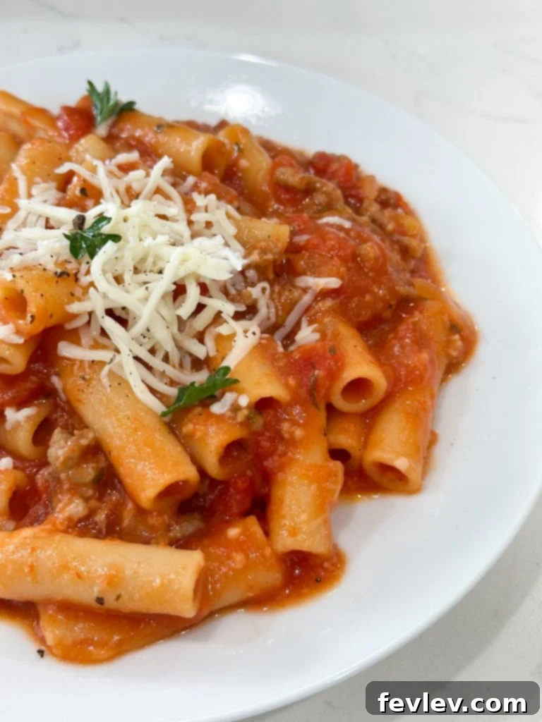 slow cooker baked ziti ready to be served from the slow cooker