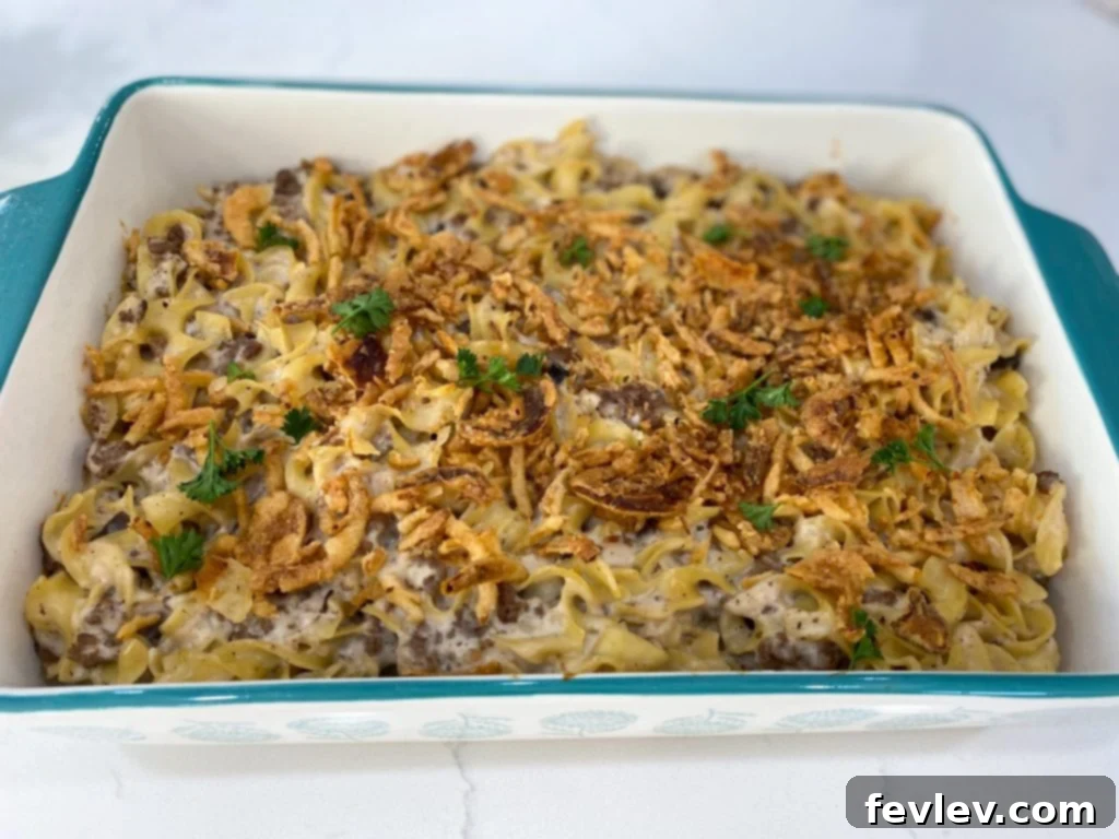 Delicious French Onion Casserole baked to perfection, topped with golden crispy fried onions, ready to be served for a family meal.