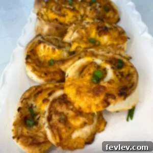 Delicious BBQ Chicken Roll Ups arranged on a plate