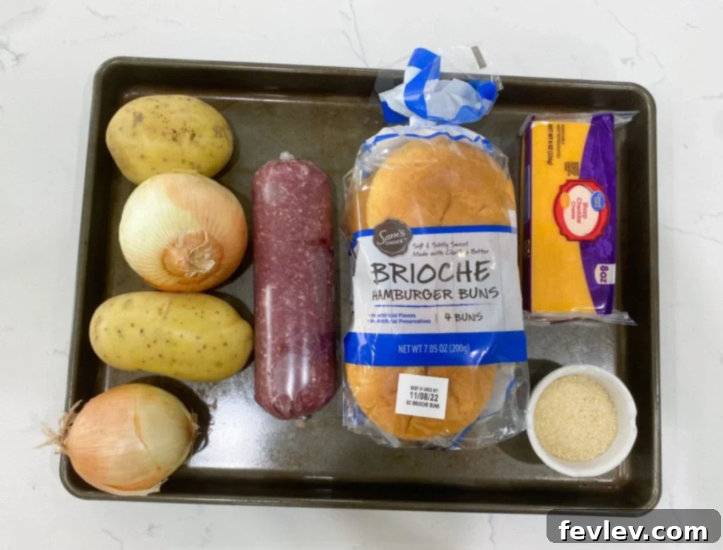 Delicious Sheet Pan Burgers with Onions and Potatoes, a perfect easy dinner meal