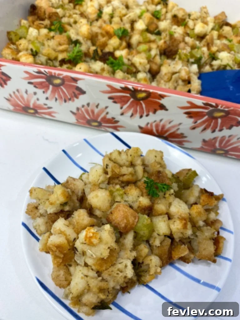 Effortless Thanksgiving Stuffing 2 A golden-brown easy Thanksgiving stuffing, freshly baked in a casserole dish, ready to be served as a classic holiday side.