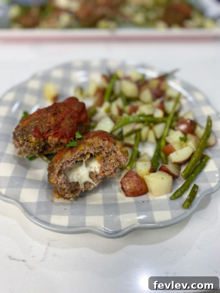 Close-up of baked Mozzarella Stuffed Meatloaf with cheese oozing out