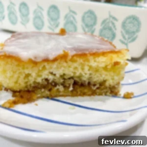 Finished Honey Bun Cake with glaze drizzled on top
