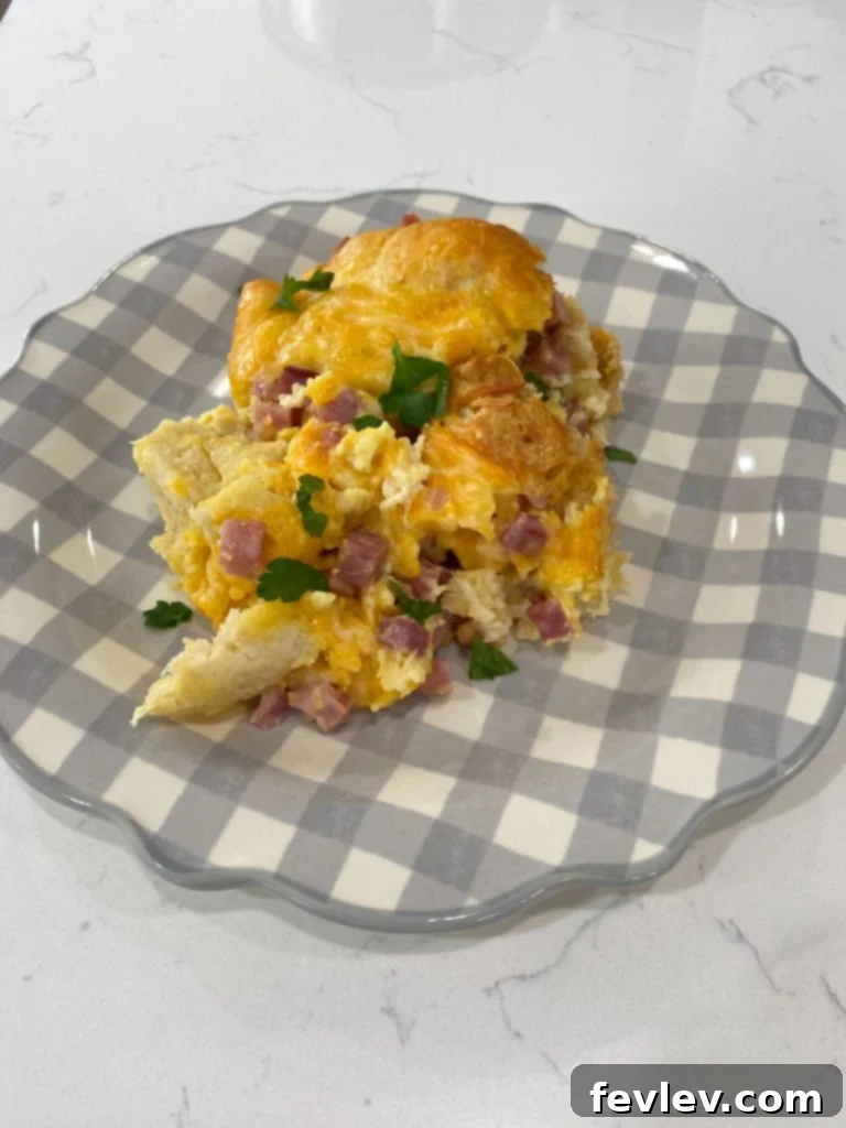 Close-up of ingredients for Slow Cooker Ham & Biscuit Casserole including ham, cheese, and biscuits.