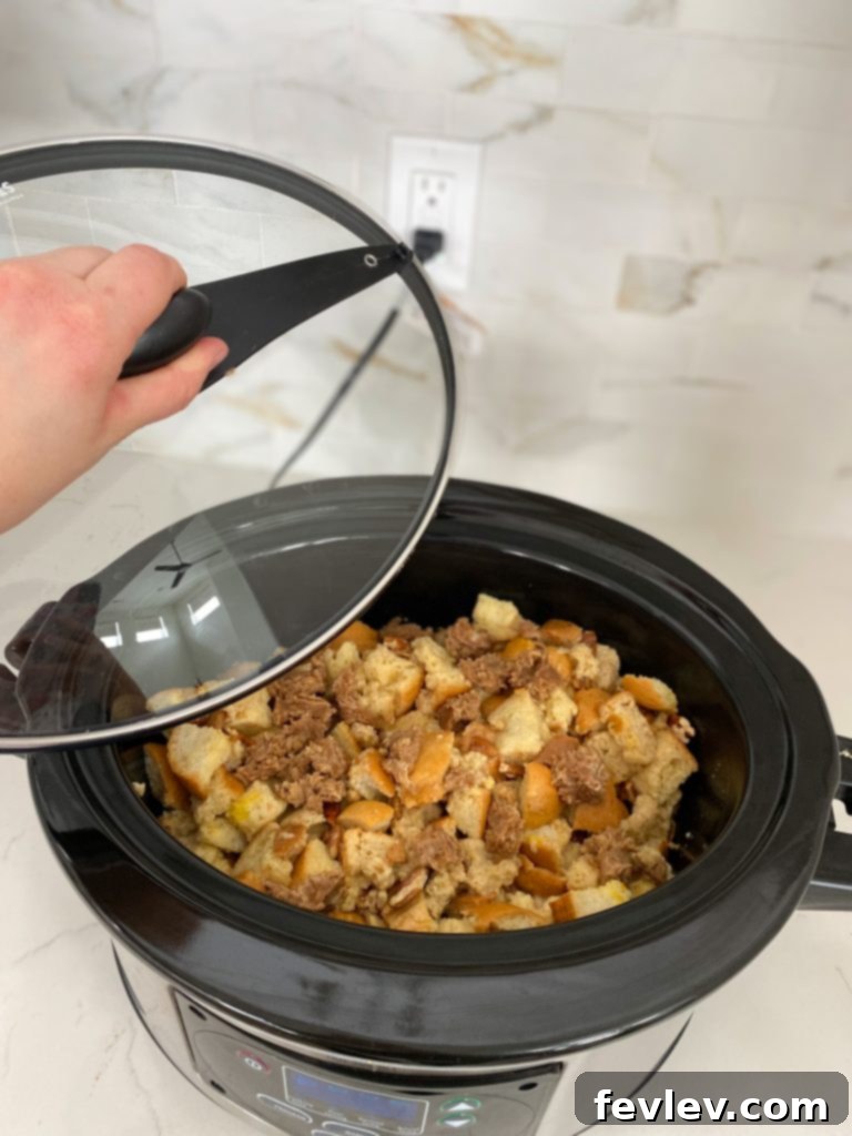 Effortless Cinnamon Pecan Slow Cooker French Toast Bake 3 Ingredients laid out for Slow Cooker French Toast Casserole, including eggs, milk, syrup, spices, bread, and pecans.