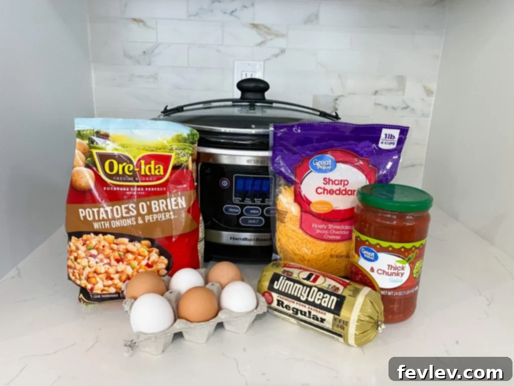 Delicious Slow Cooker Breakfast Burritos ready to be served, filled with eggs, sausage, potatoes, and cheese, on a white plate with a fork.