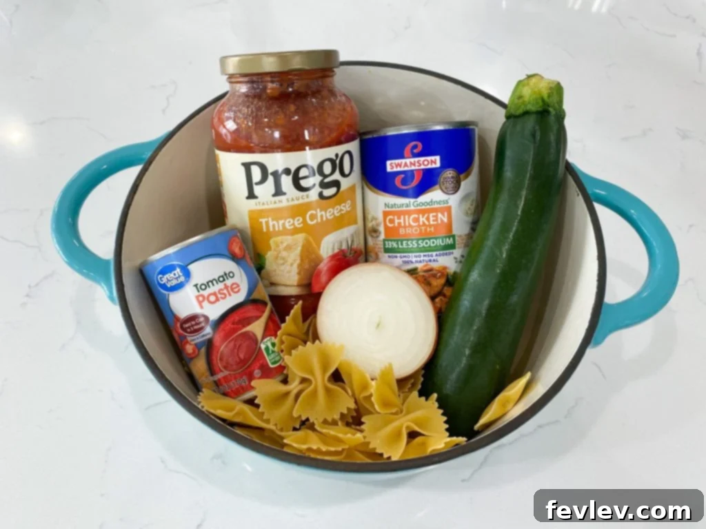 A vibrant, close-up shot of one-pot Italian vegetable pasta with bow-tie pasta, colorful bell peppers, zucchini, and mushrooms, garnished with fresh parsley.