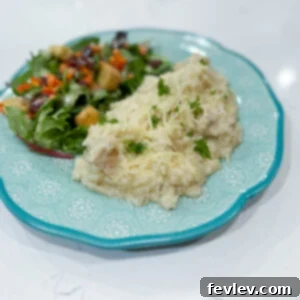 A close-up view of the finished Italian Chicken and Rice dish in a serving bowl.
