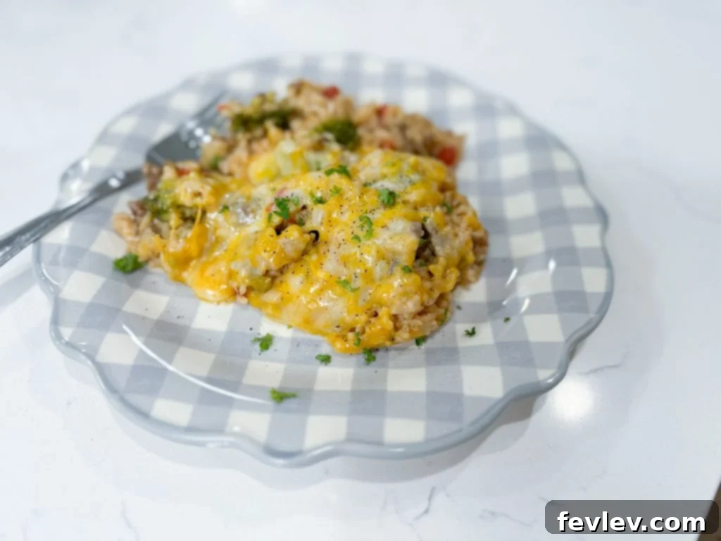 Close-up of the cooked Mexican Beef and Rice Skillet, highlighting the tender rice, savory beef, and perfectly melted cheese, with a hint of green chiles.
