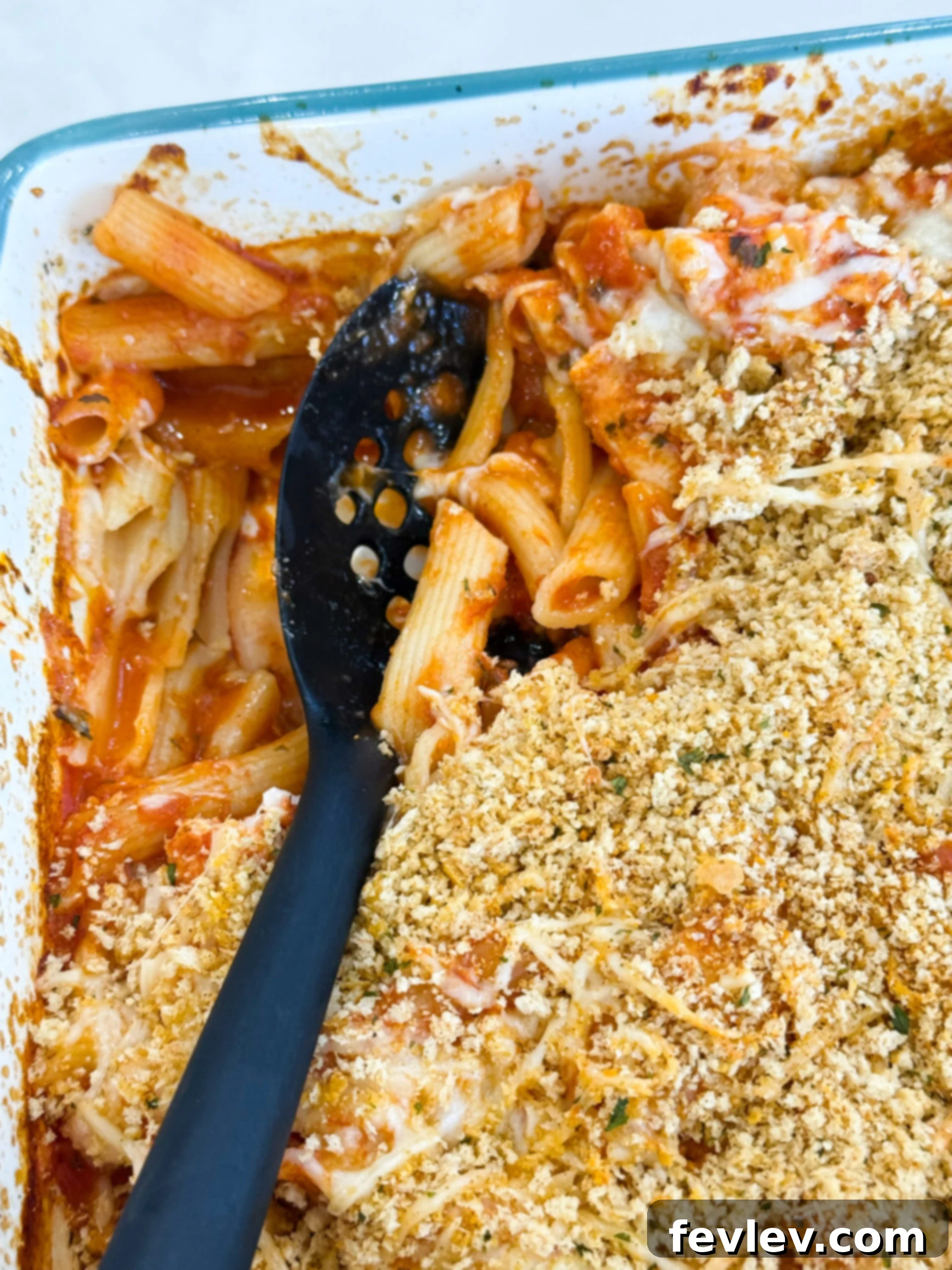 Golden baked chicken parmesan casserole with a crispy, cheesy topping, served directly from the dish