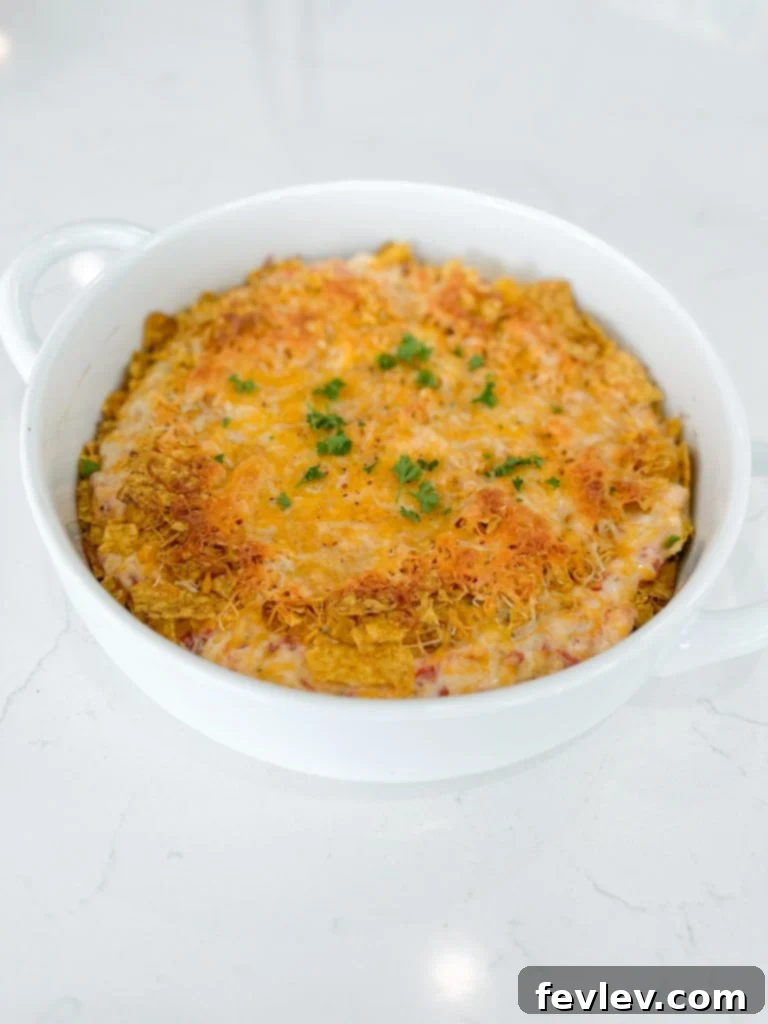 A freshly baked Dorito Chicken Casserole, with golden brown topping and bubbling cheese.